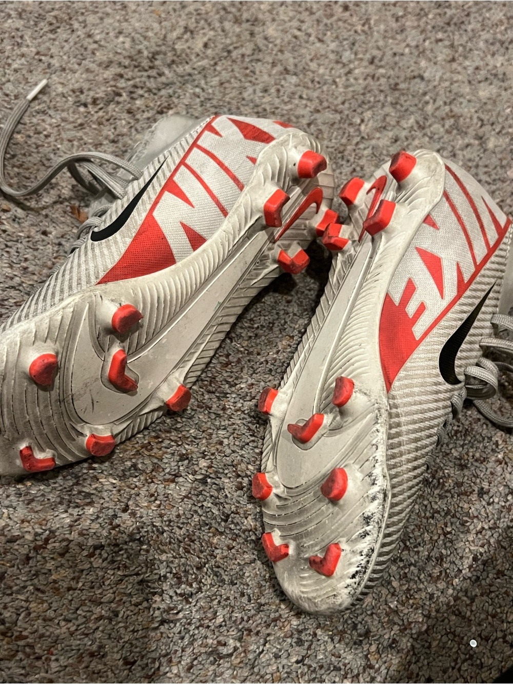 Kids Nike Mecurial White Soccer Cleats with Red Accents and Black Swoosh